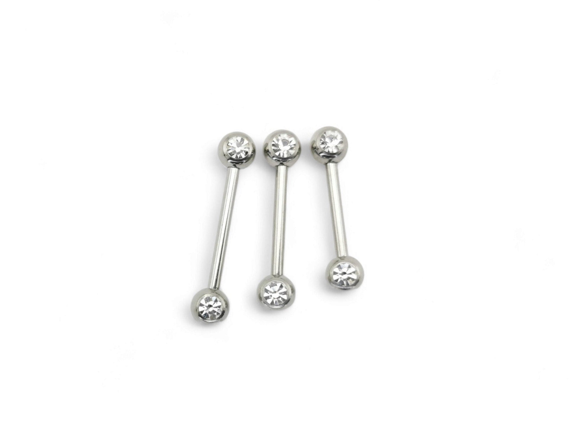 A set of three surgical steel barbells with jewelled ends, varying in length, on a white background.