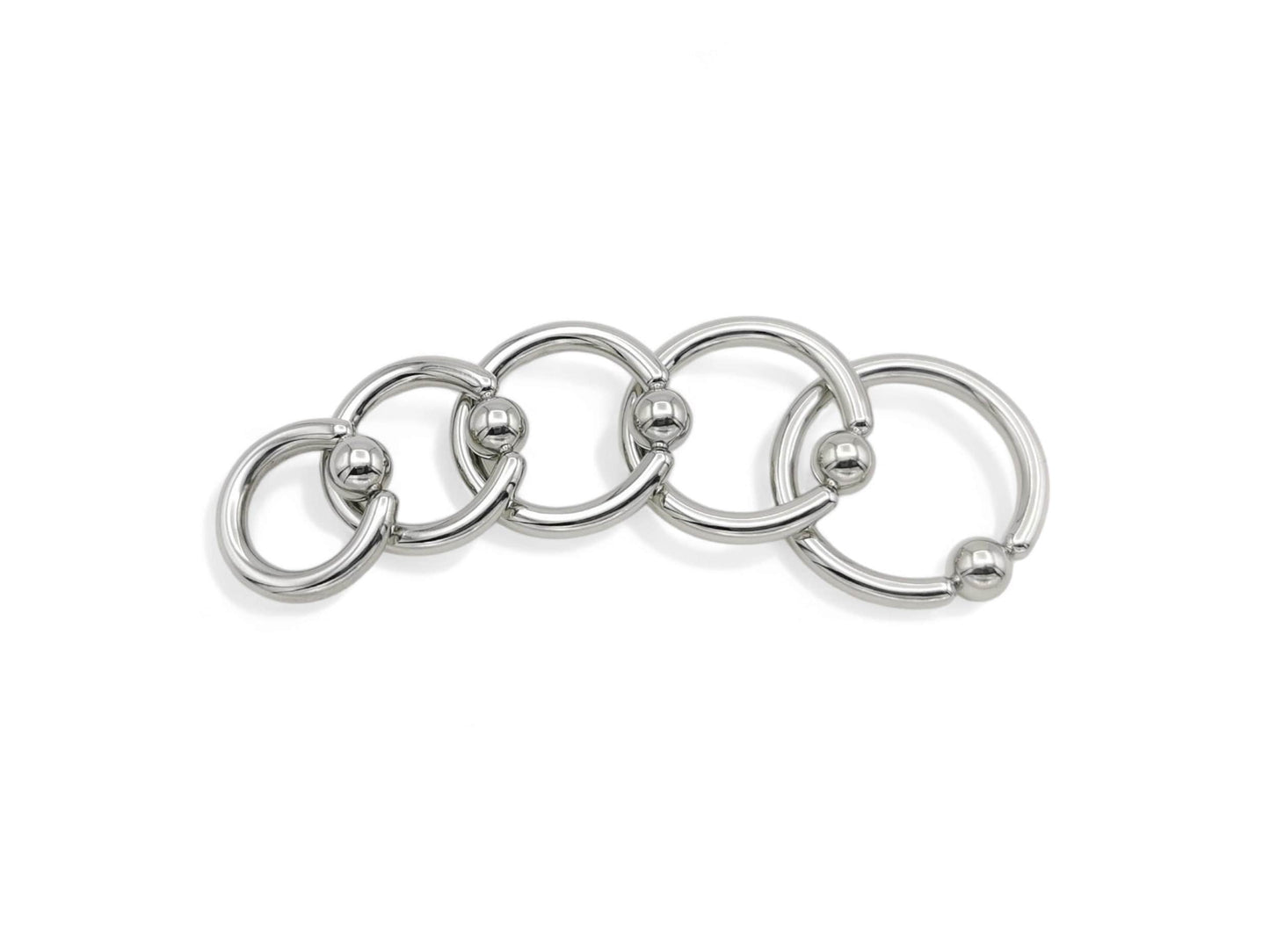 A set of five surgical steel BCRs with a ball closure design on a white background