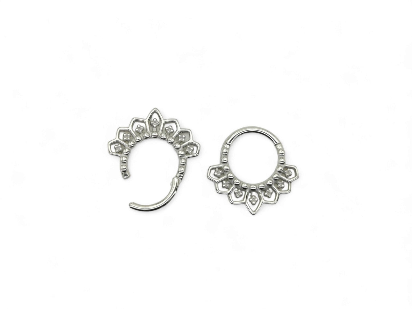 Surgical steel mandala clicker rings, for septum or a daith piercing, with intricate filigree patterns on a white background