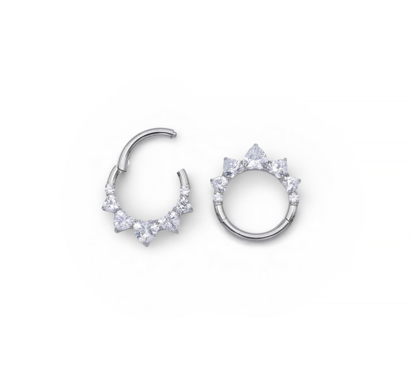 Pair of silver hoop earrings with clear gemstones on a white background