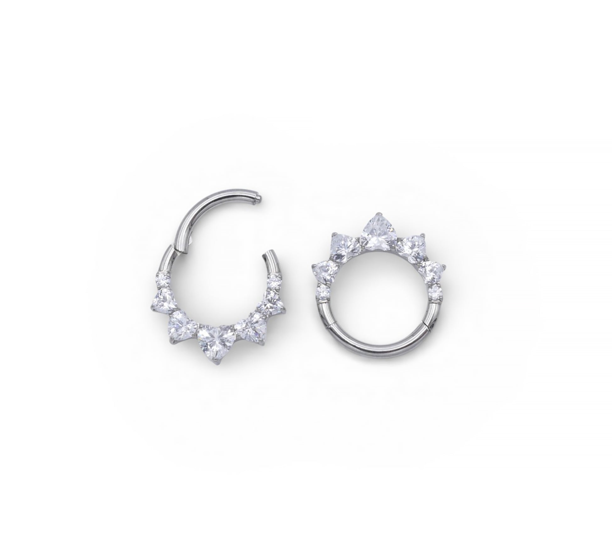 Pair of silver hoop earrings with clear gemstones on a white background