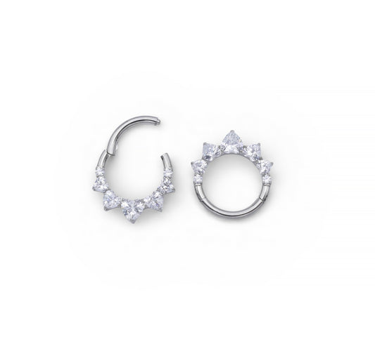 Pair of silver hoop earrings with clear gemstones on a white background