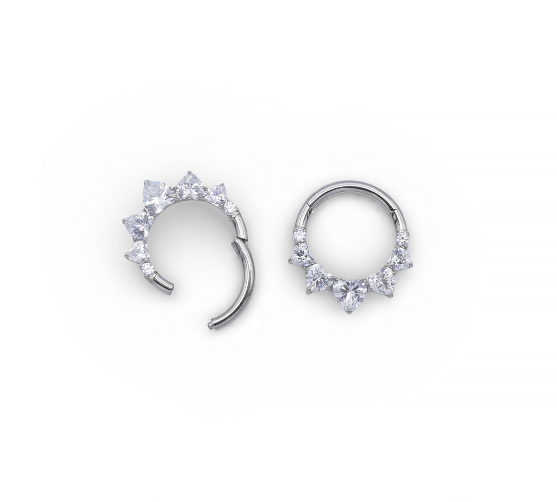 Silver hoop earrings with small gemstones on a white background
