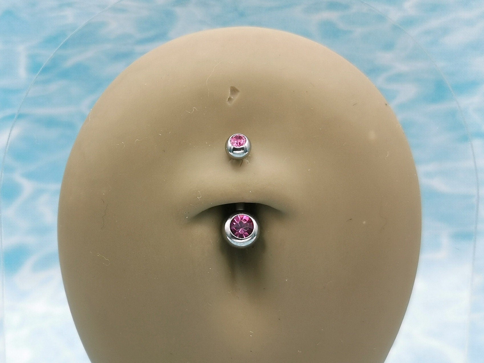 Titanium Double Jewelled Belly Bar on a stand