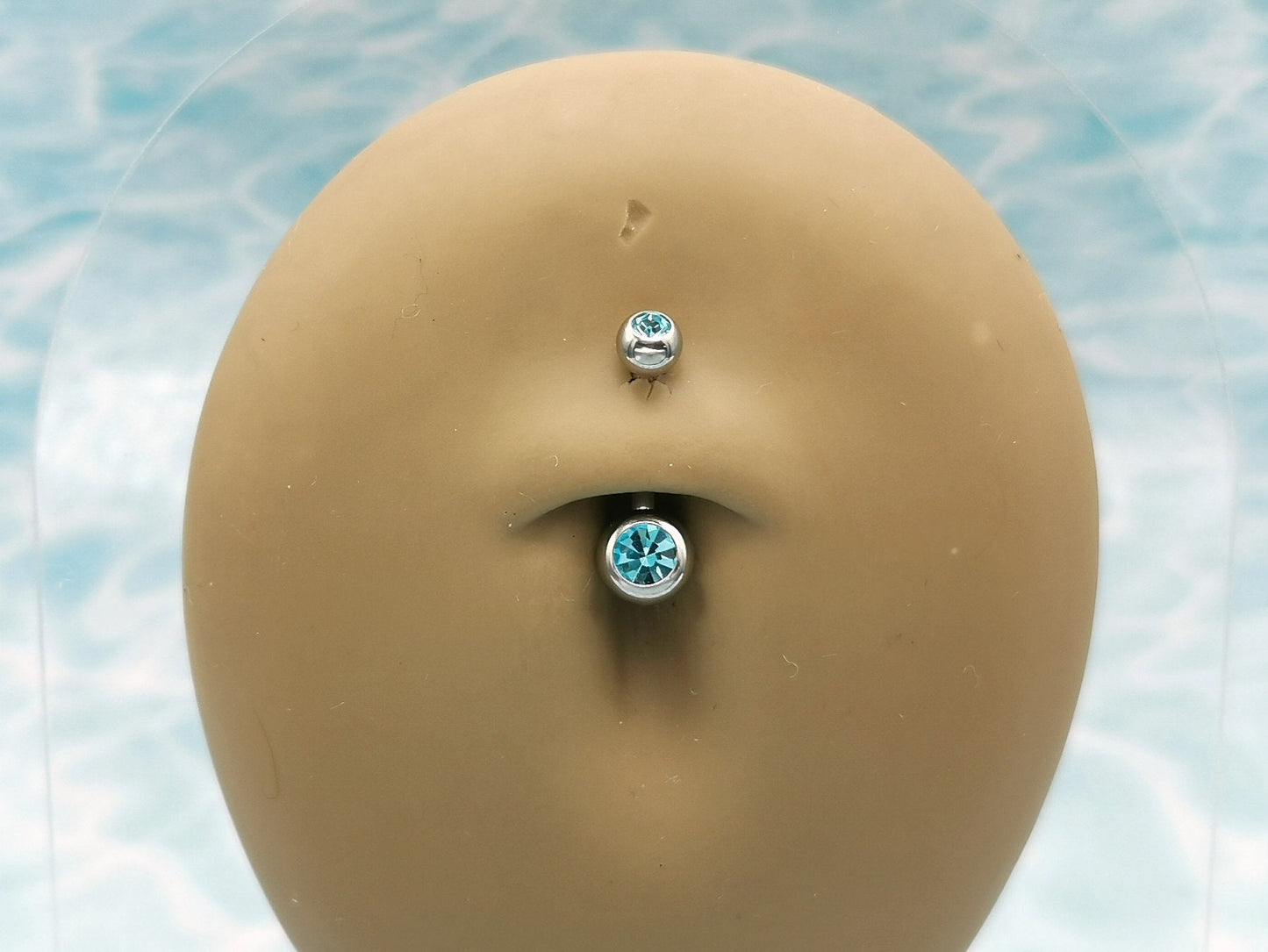 Titanium Double Jewelled Belly Bar on a stand