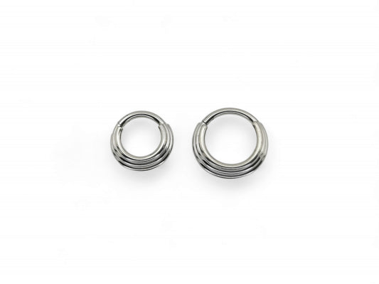 Two titanium illusion clicker rings with a bright polished finish, intended for septum piercings, presented on a white background.