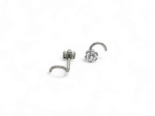 A titanium jewelled flower nose stud with a 4mm diameter flower and claw set design, adorned with 7 dainty brilliant cut crystals.