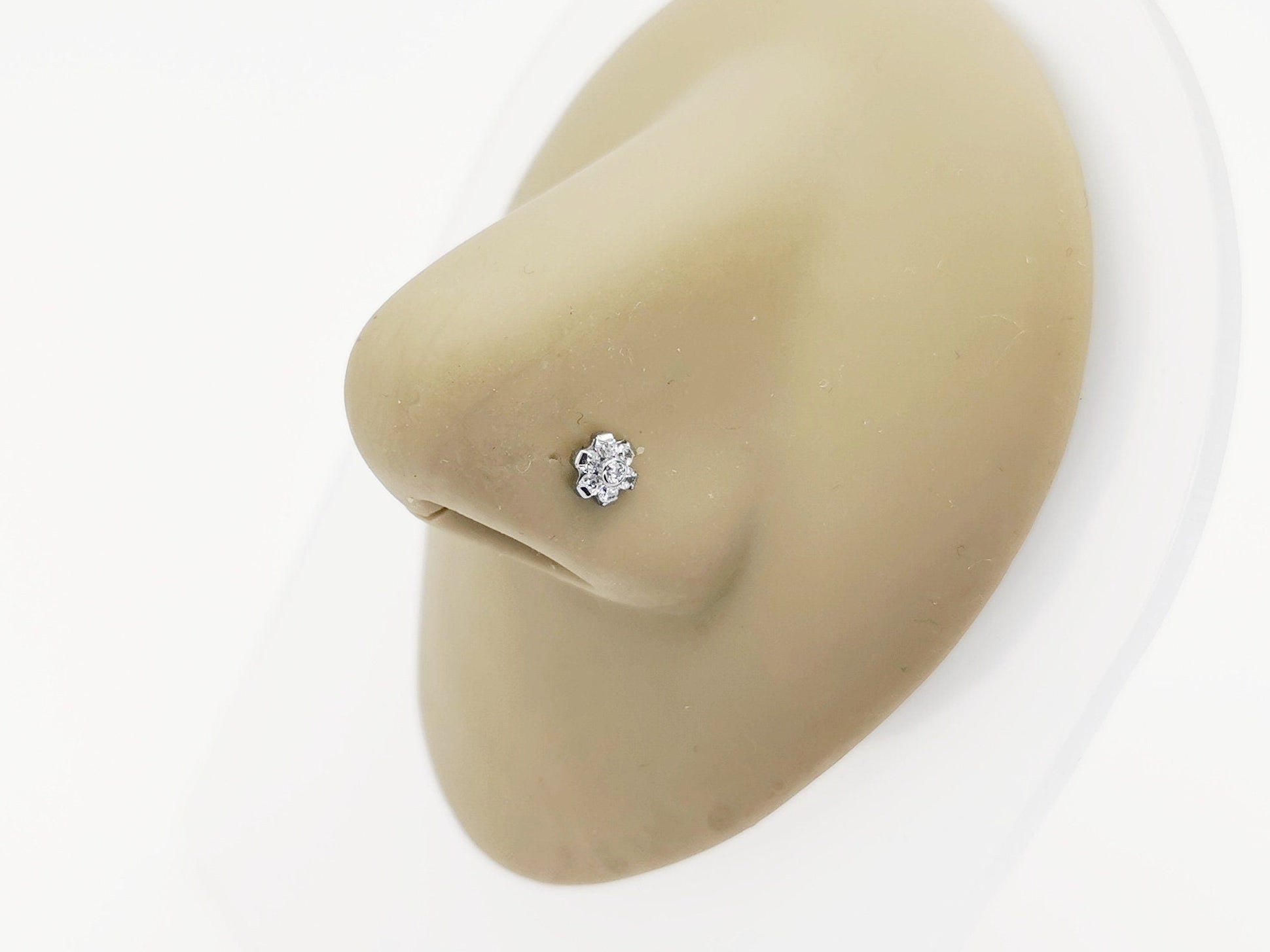 Titanium Jewelled Flower Nose Stud on a nose