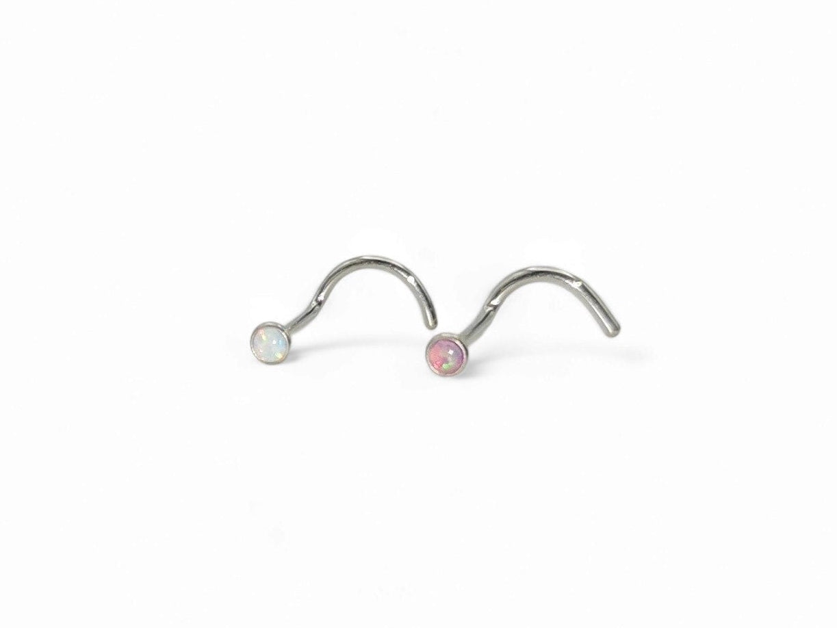 Titanium jewelled opal nose studs for 1mm/18g piercings, featuring a metallic silver tone with a central opal stone surrounded by clear stones.