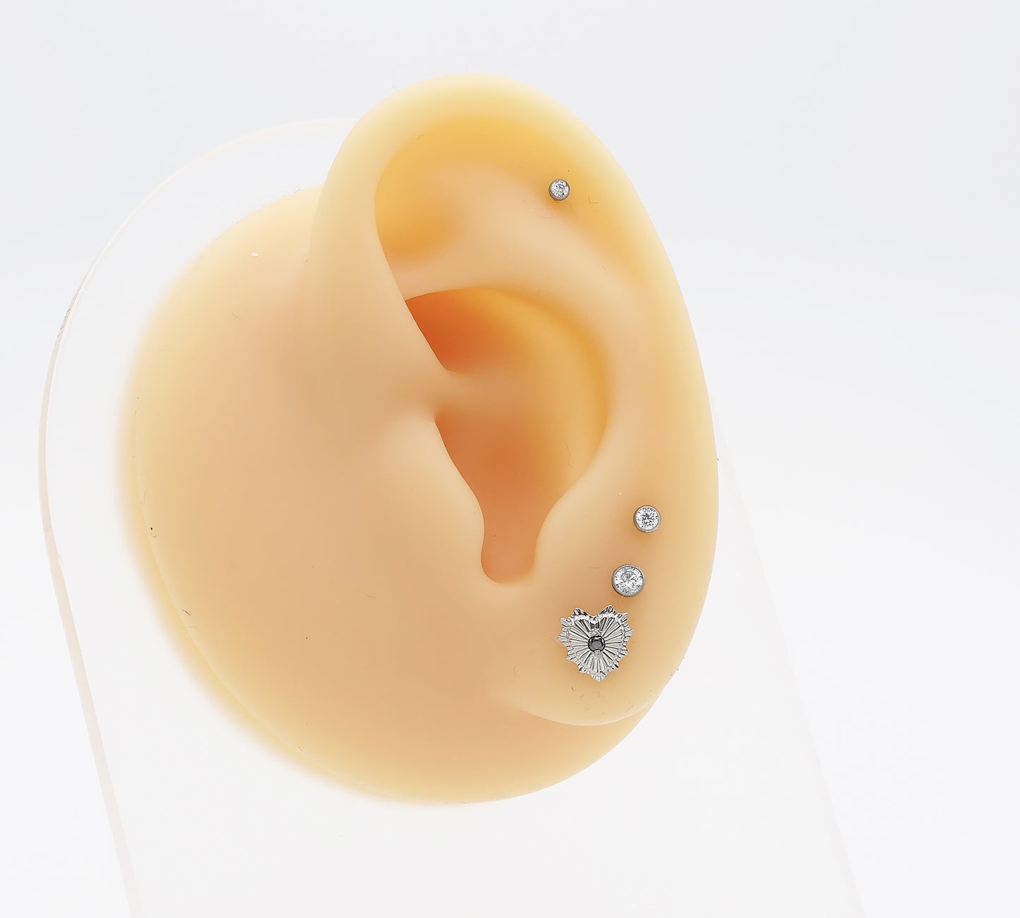 Titanium Radiant Heart Jewelled Stud on a mannequin ear