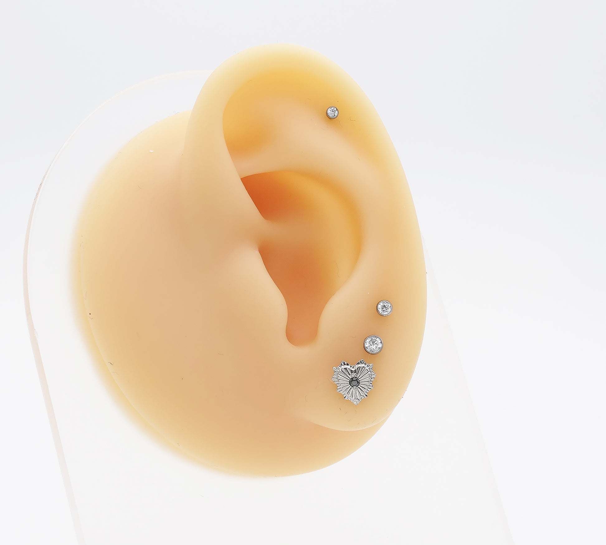 Titanium Radiant Heart Jewelled Stud on a mannequin ear