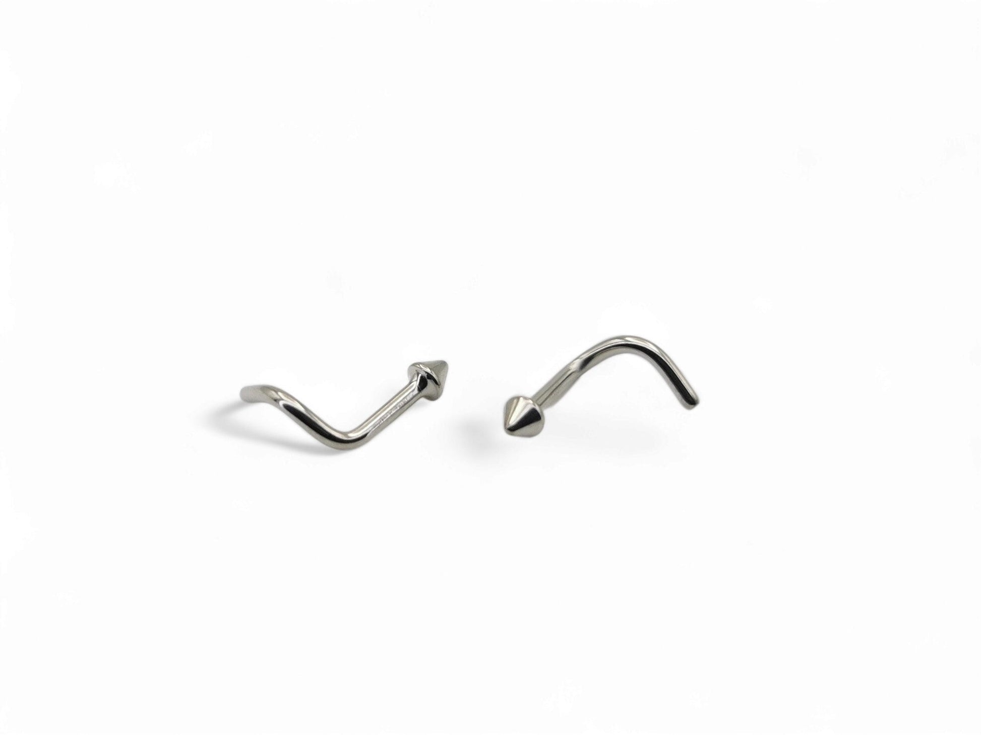 A polished finish titanium nose stud with a long spike, designed for 18g piercings.