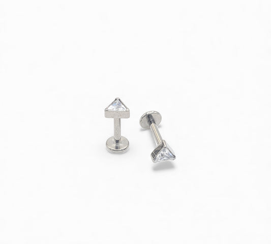 Two silver stud earrings with clear gemstones on a white background