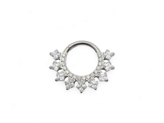 A titanium jewelled hinged clicker ring with a cluster of square-cut gems around the main ring.