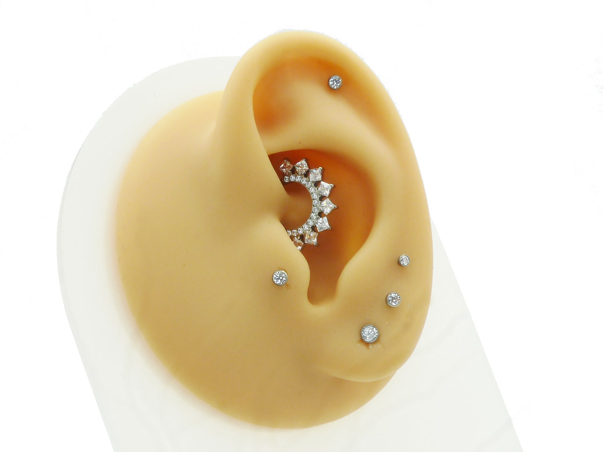 Titanium Verity Jewelled Hinged Clicker Ring on an ear