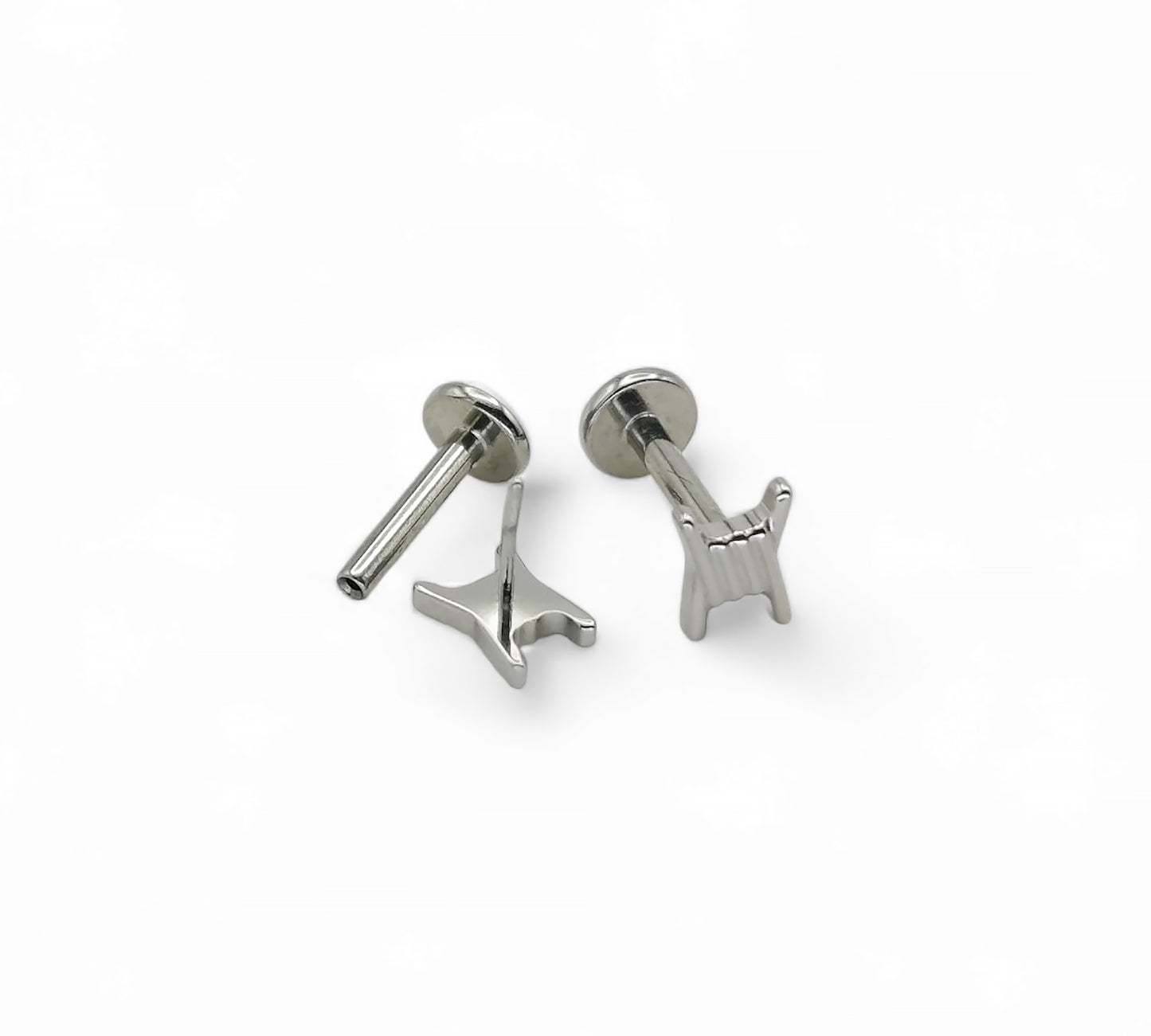 Two titanium barb wire threadless studs with a push-fit design