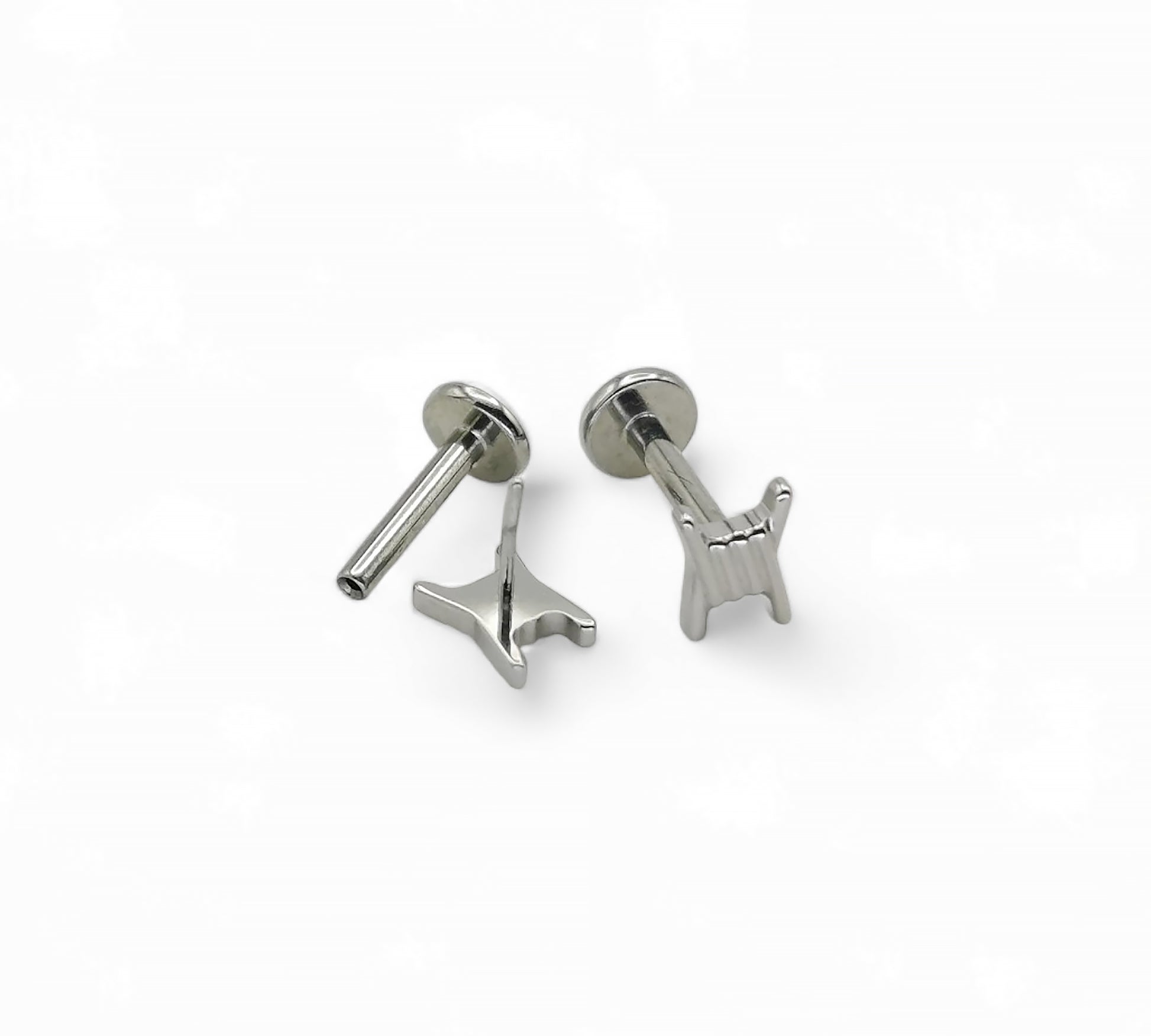 Two titanium barb wire threadless studs with a push-fit design