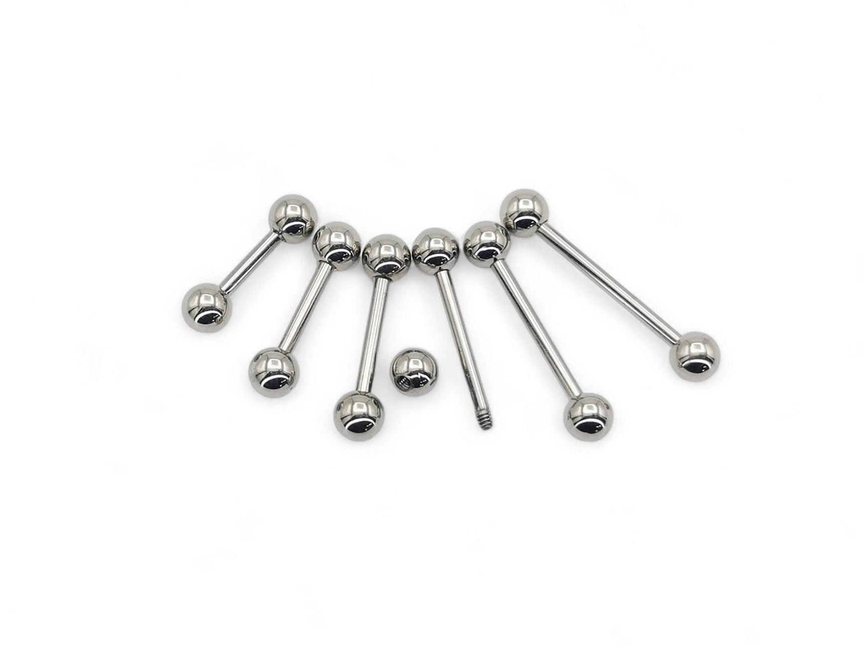 A set of polished titanium barbells with varying lengths, designed for piercings, presenting a metallic sheen.