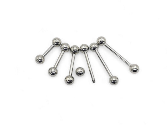A set of polished titanium barbells with varying lengths, designed for piercings, presenting a metallic sheen.
