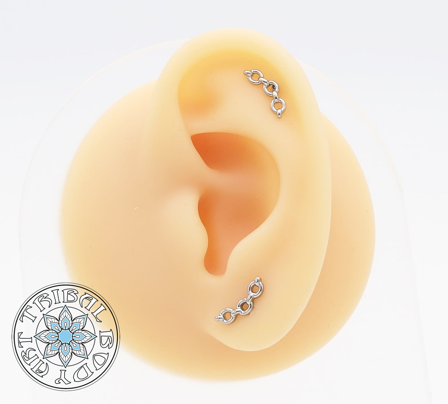 A pair of polished titanium chain link studs designed for 1.2mm internal thread posts.