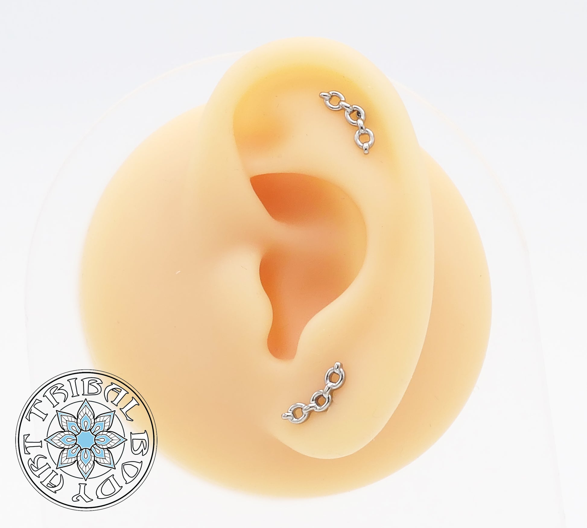 A pair of polished titanium chain link studs designed for 1.2mm internal thread posts.