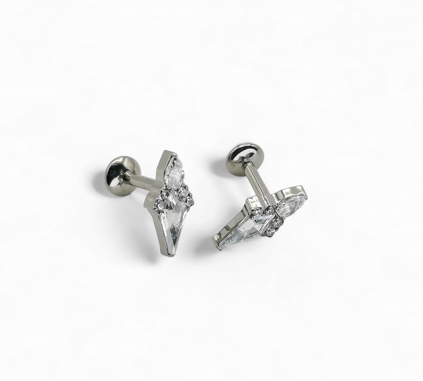 A pair of titanium claw set Stella jewelled kite stud earrings with internally threaded posts, featuring a kite-shaped gem surrounded by a smaller pear-cut jewel and four round-cut gems.