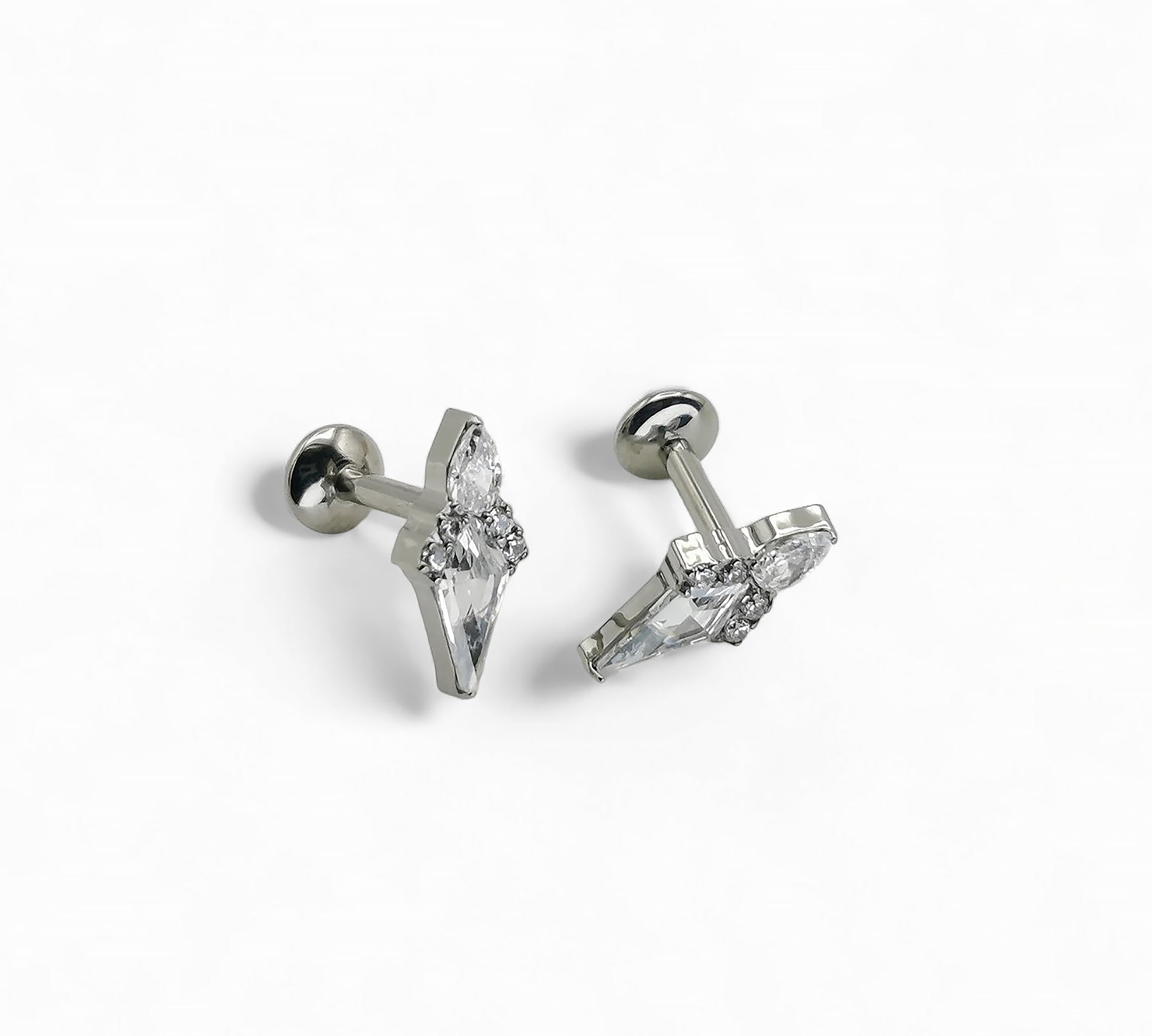 A pair of titanium claw set Stella jewelled kite stud earrings with internally threaded posts, featuring a kite-shaped gem surrounded by a smaller pear-cut jewel and four round-cut gems.