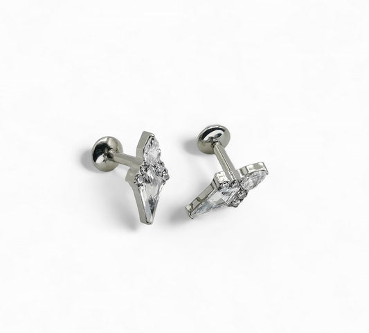 A pair of titanium claw set Stella jewelled kite stud earrings with internally threaded posts, featuring a kite-shaped gem surrounded by a smaller pear-cut jewel and four round-cut gems.
