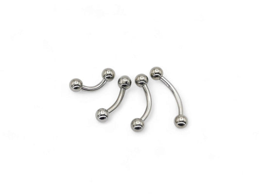 A set of four titanium curved barbells with screw fit balls, intended for various types of body piercings.