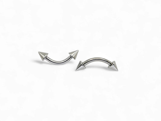 Surgical steel curved barbell with spikes, intended for eyebrow, rook, and anti tragus piercings.