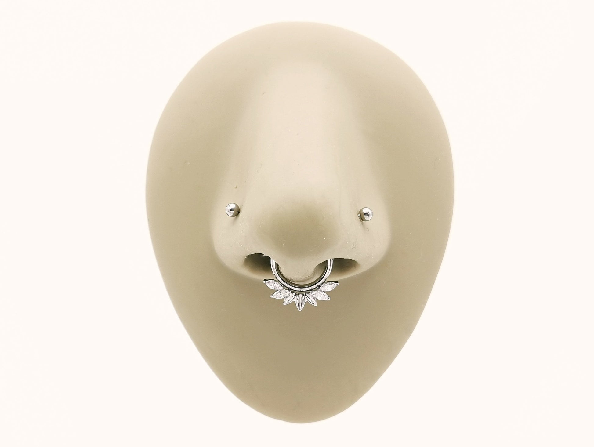 Titanium fan clicker set with marquise in a mannequin nose