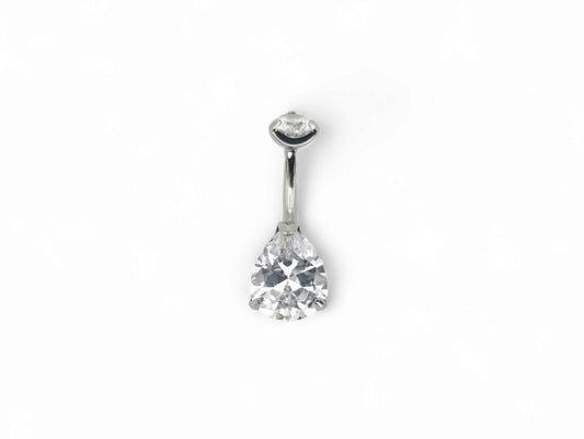 Titanium jewelled claw set belly bar with a brilliant cut pear gem and a round brilliant cut gem, set in a silver-tone mounting.