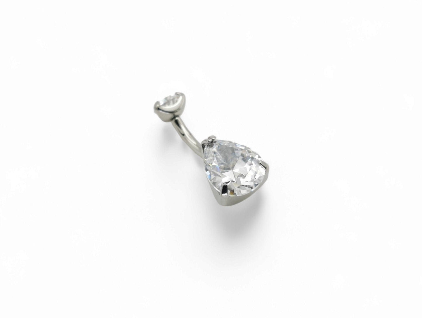 Titanium jewelled claw set belly bar on a white background