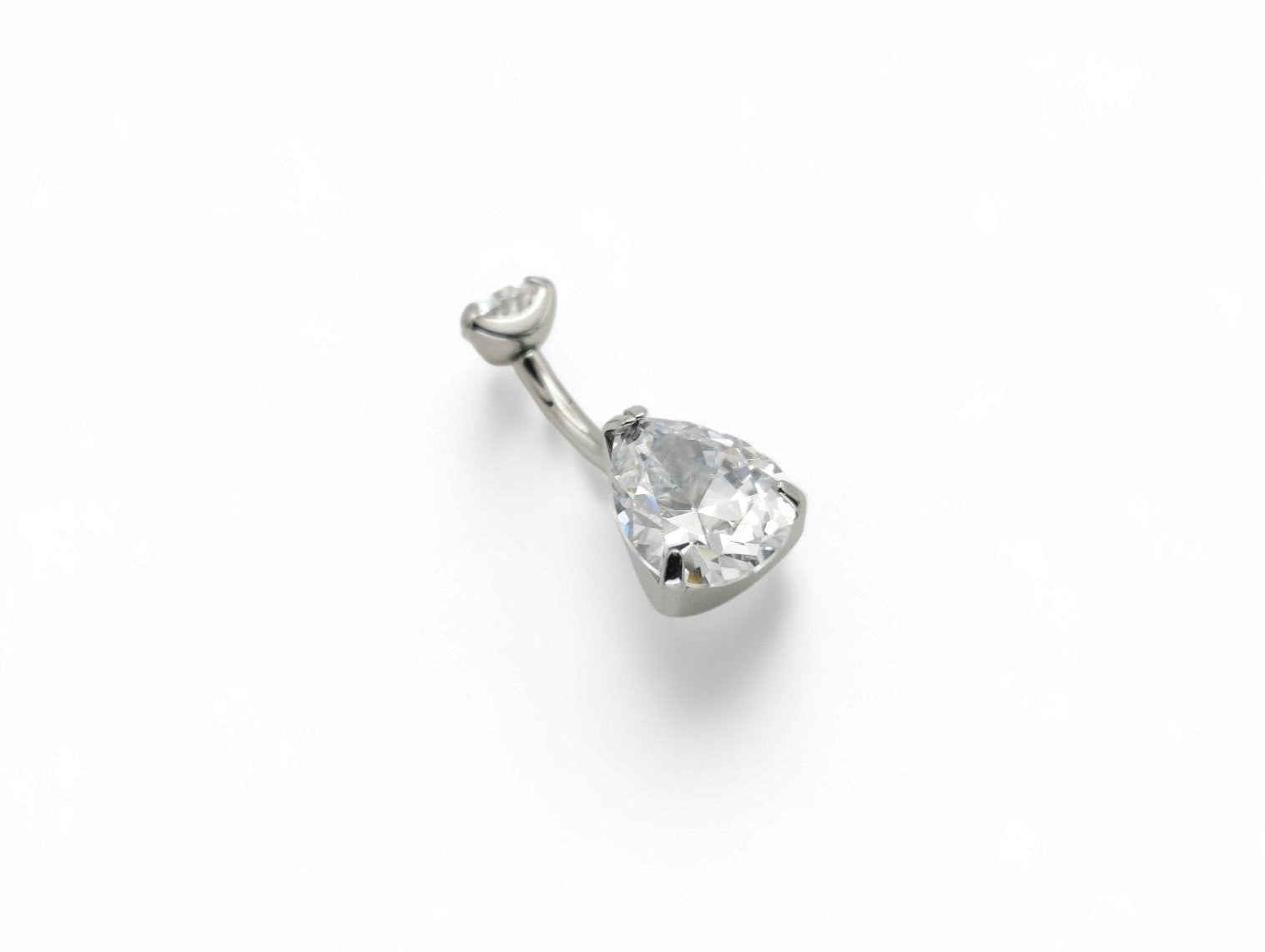 Titanium jewelled claw set belly bar on a white background