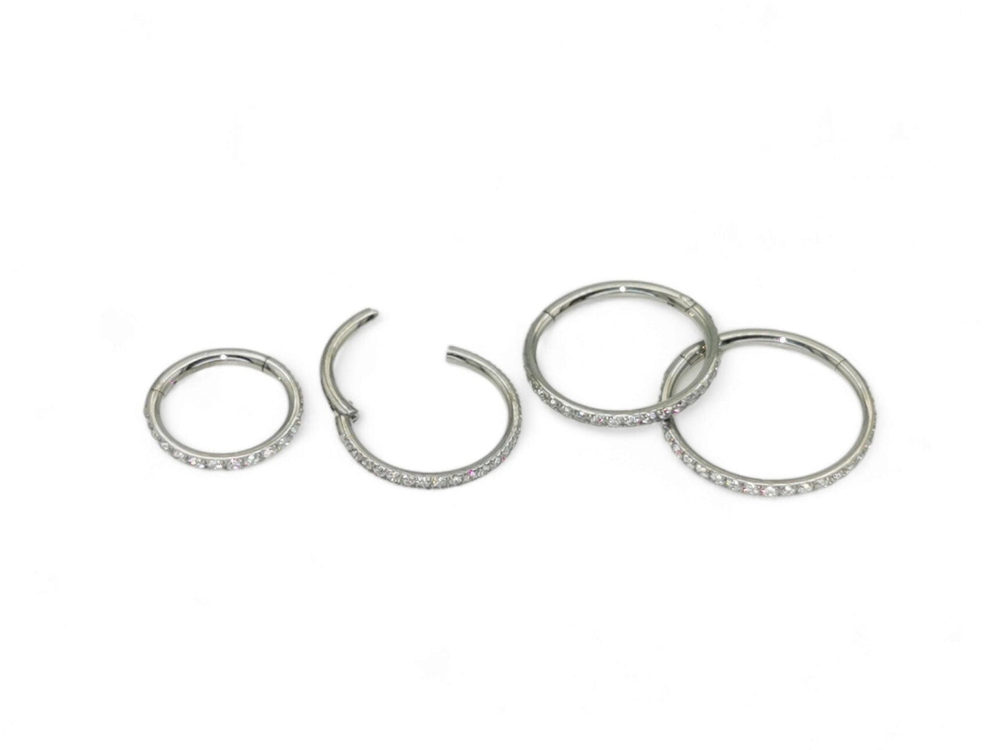 Titanium jewelled clicker ring with clear crystal pave set, intended for use with 1.2mm/16g piercings.