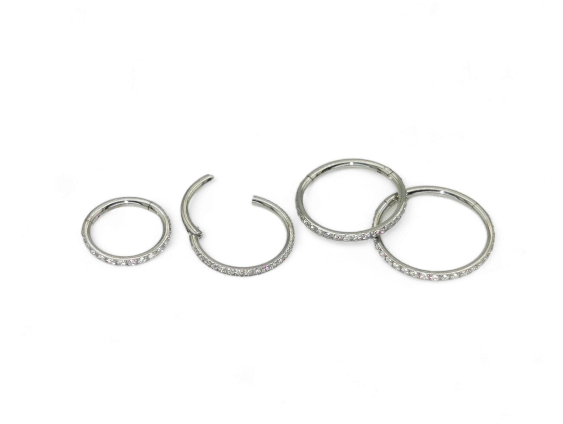 Titanium jewelled clicker ring with clear crystal pave set, intended for use with 1.2mm/16g piercings.