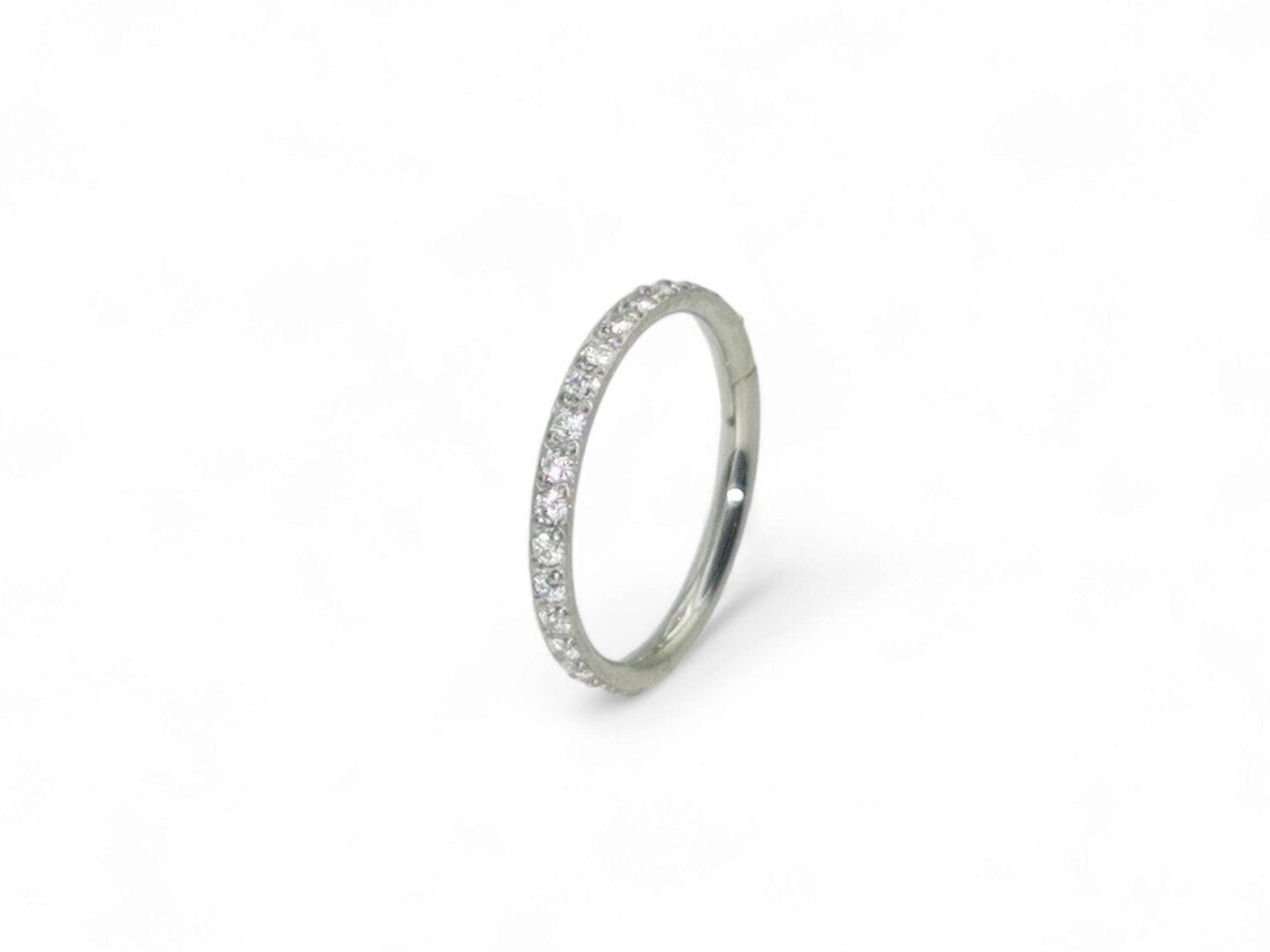 Titanium jewelled clicker ring with clear crystal pave set, intended for use with 1.2mm/16g piercings.