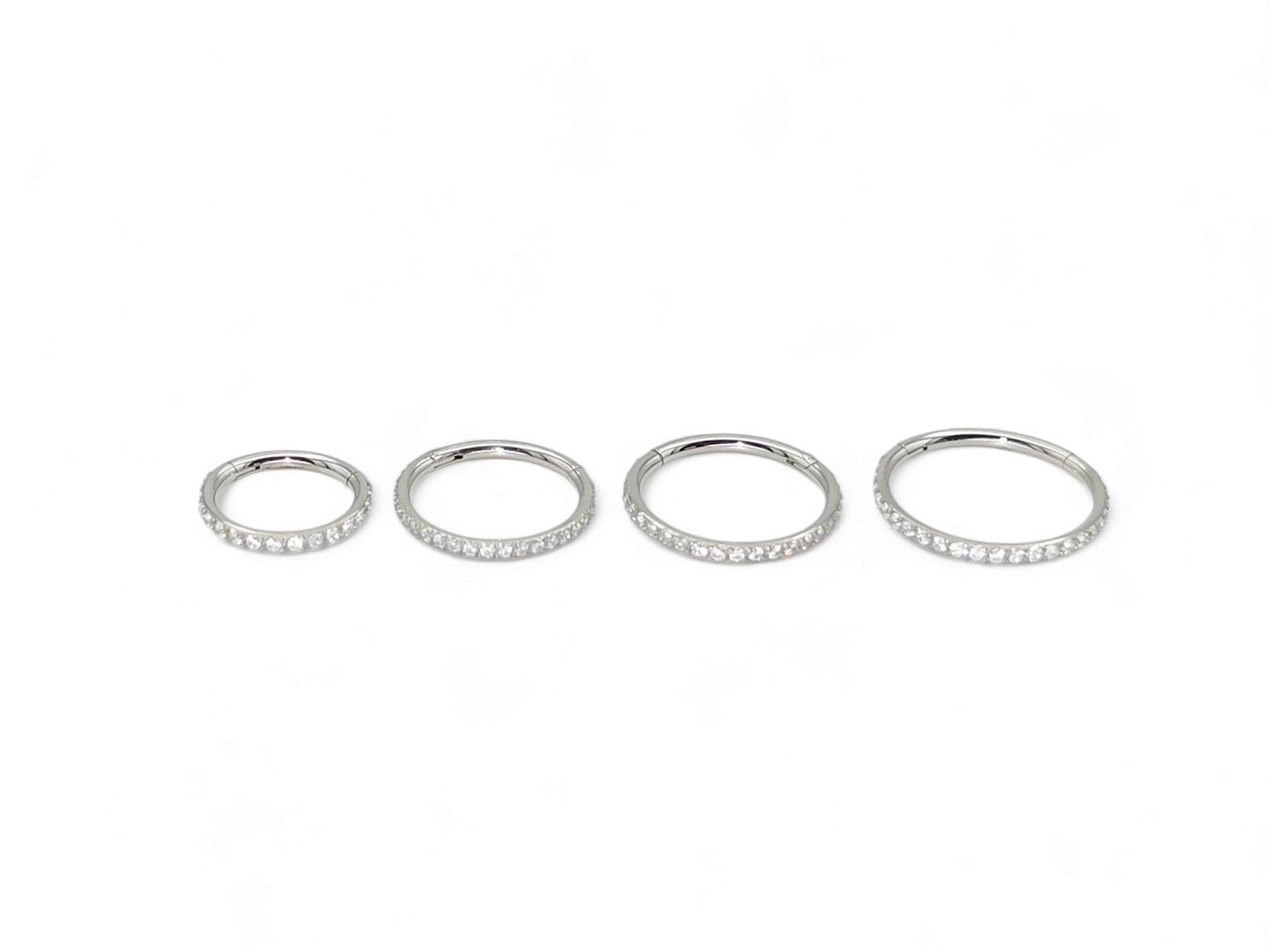 Titanium jewelled clicker ring with clear crystal pave set, intended for use with 1.2mm/16g piercings.