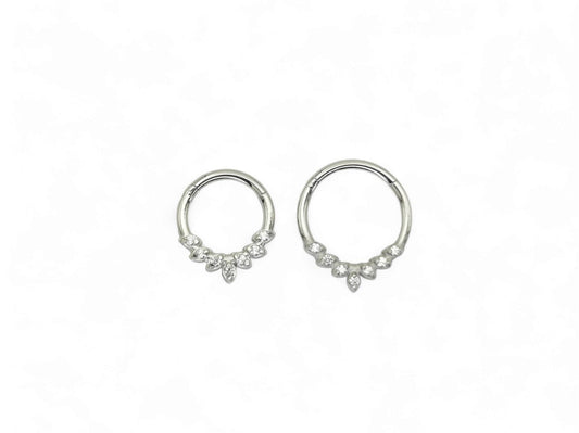 A pair of Titanium jewelled clicker rings with a laurel wreath detail, featuring cubic zirconia jewels.