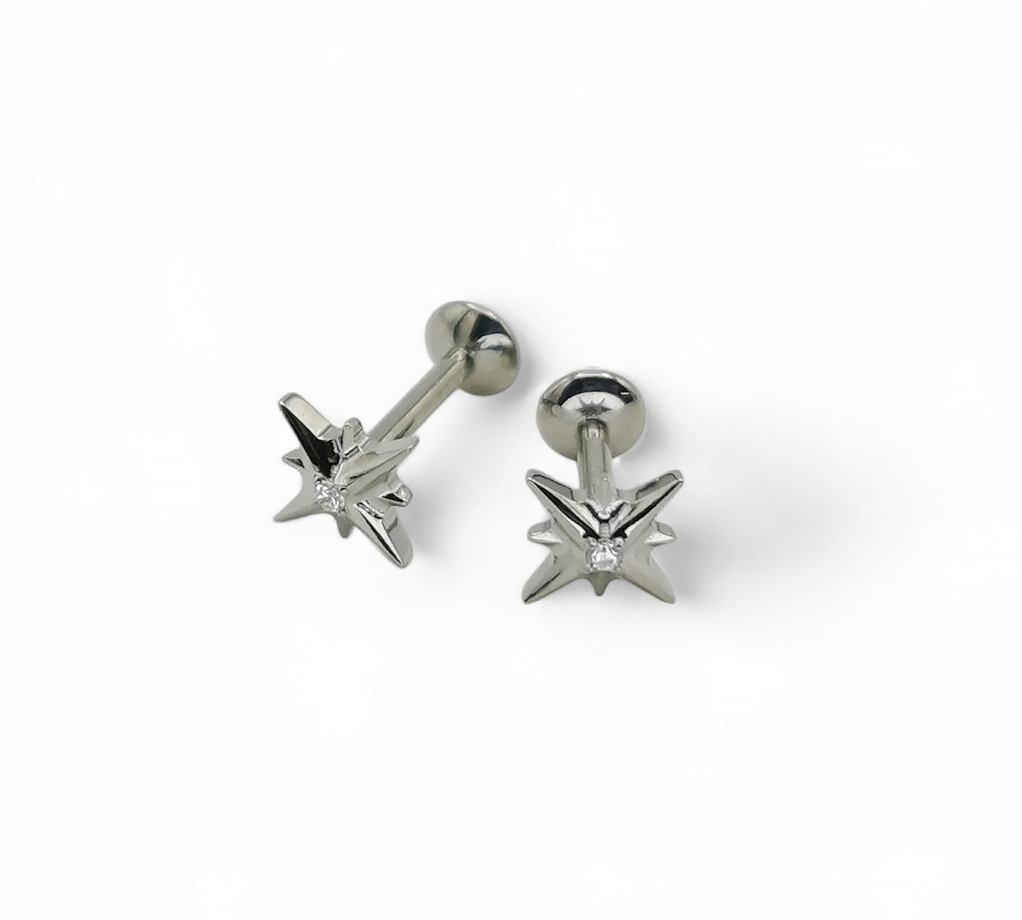 A single titanium labret stud with a jewelled star design, displayed against a white background.