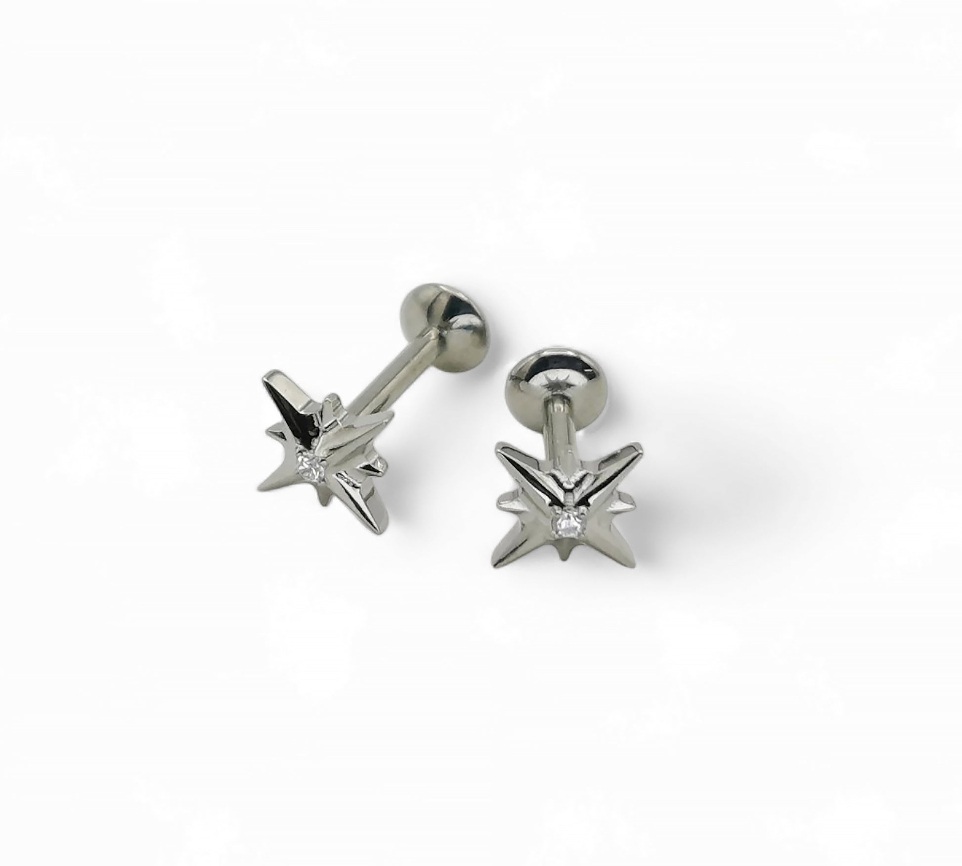 A single titanium labret stud with a jewelled star design, displayed against a white background.