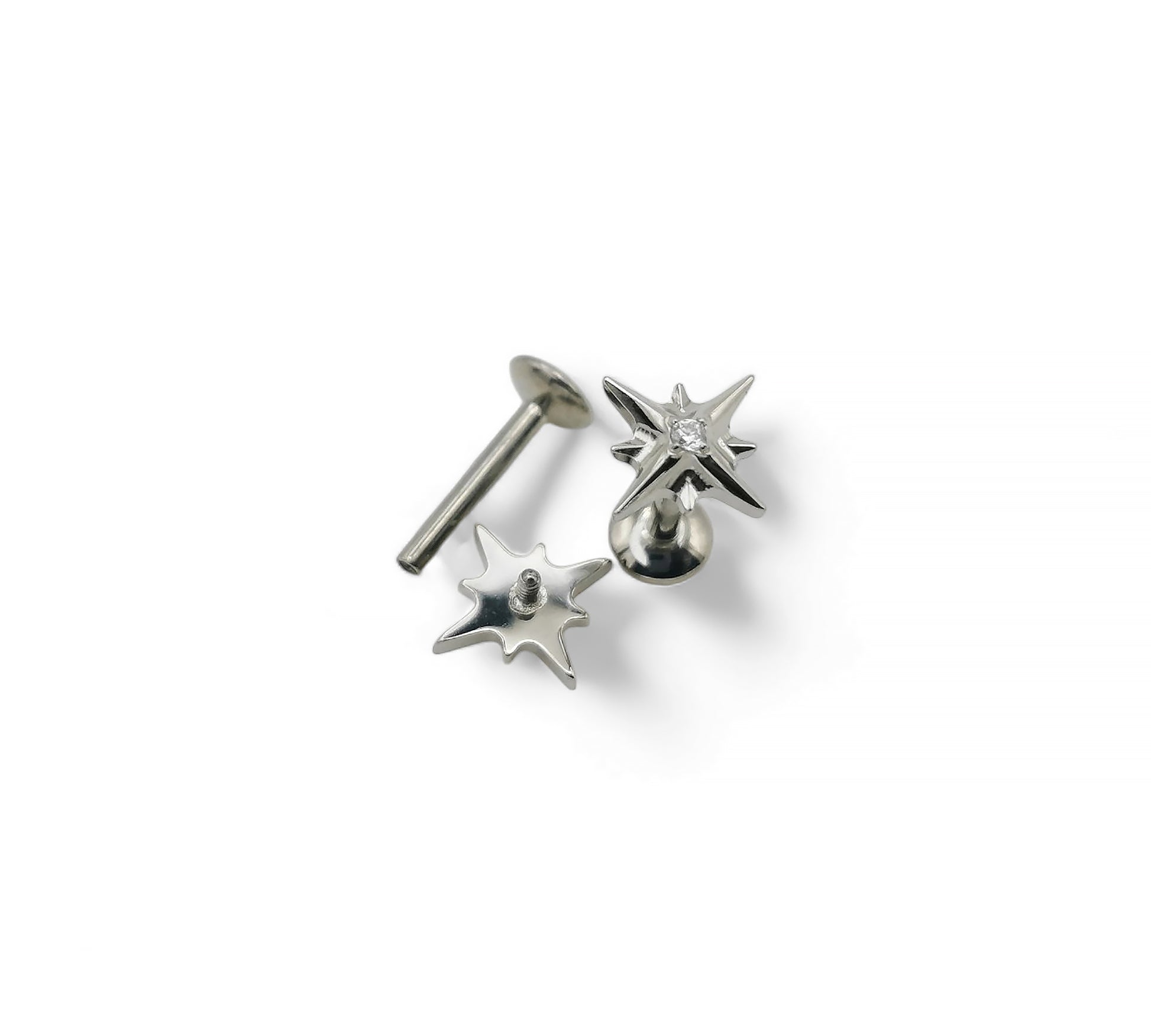 Pair of silver star-shaped earrings on a white background