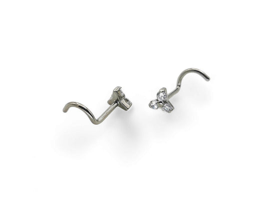 Titanium jewelled trinity nostril studs on a white background