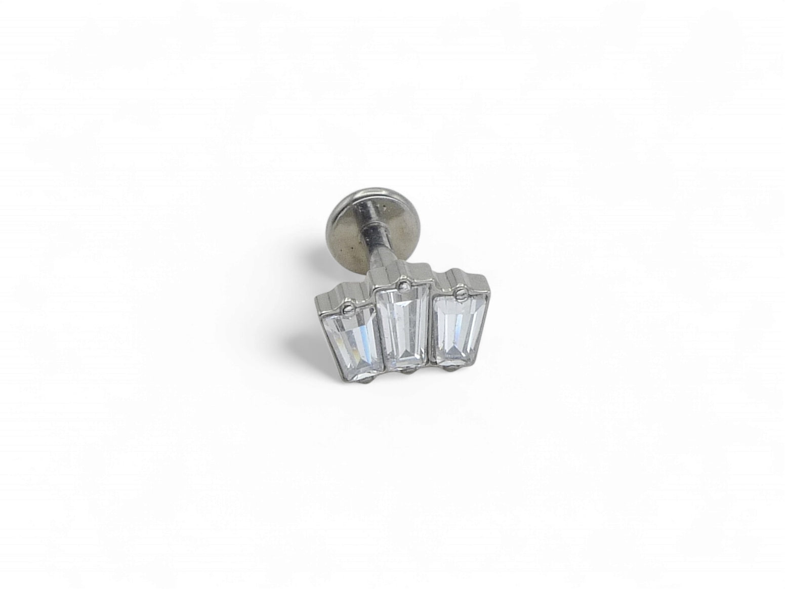 A single titanium push fit baguette cluster stud with multiple clear gemstones, against a white background.