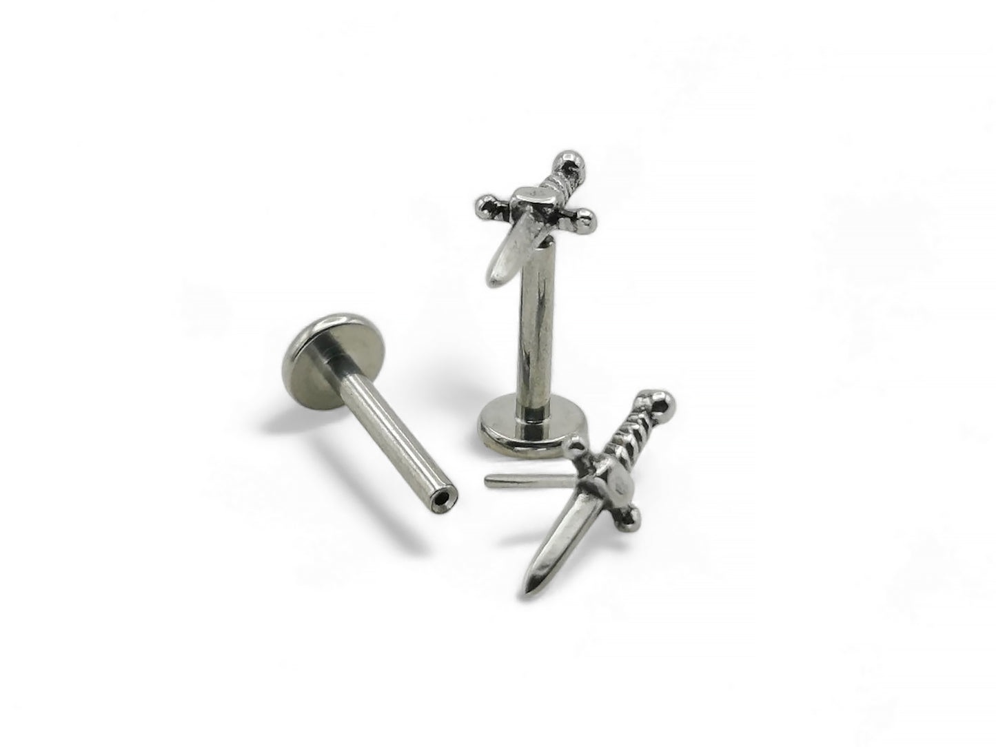 A high-polish finished titanium push fit dagger stud with a detailed surgical steel dagger top, displayed against a white background.