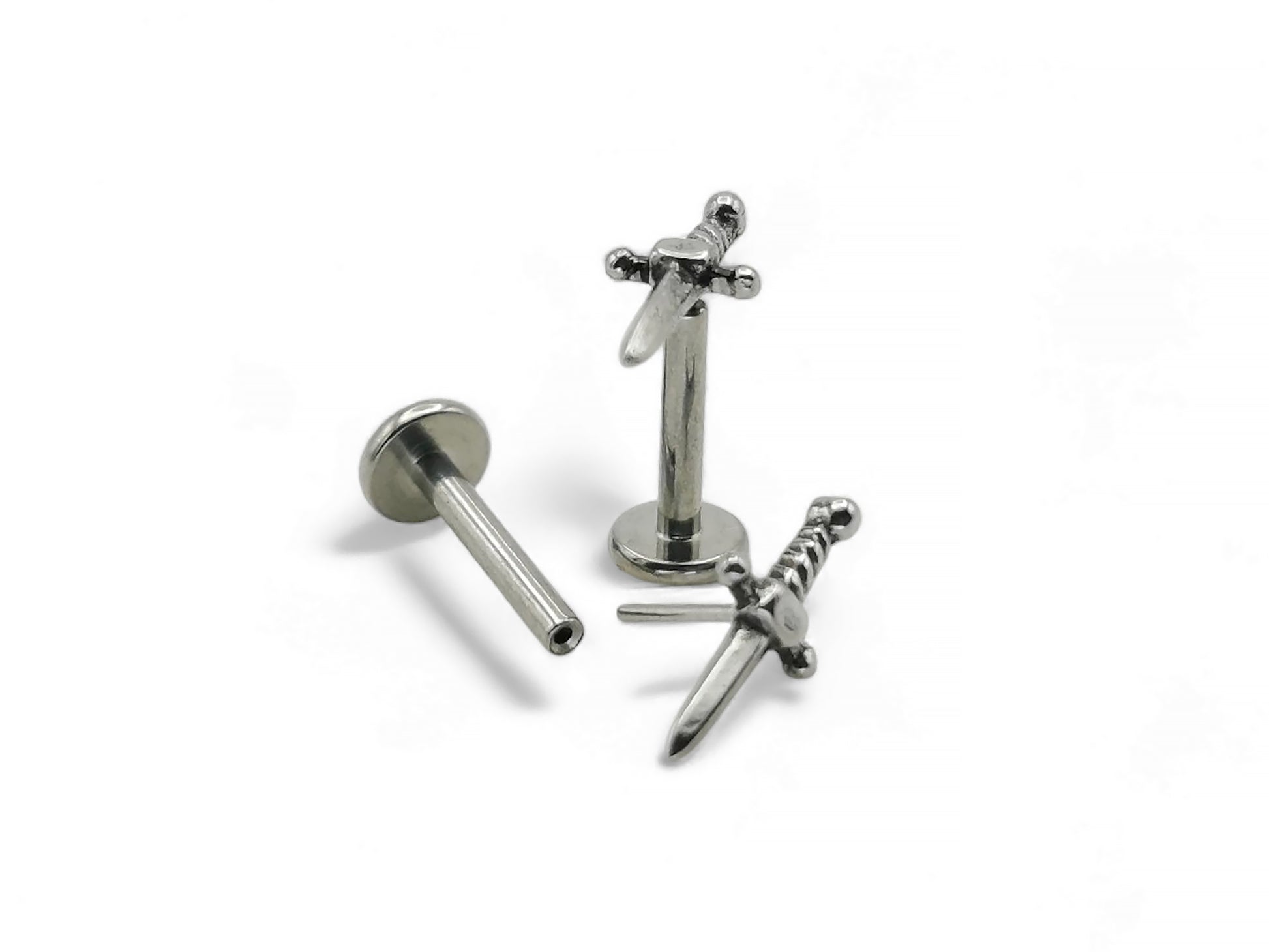 A high-polish finished titanium push fit dagger stud with a detailed surgical steel dagger top, displayed against a white background.