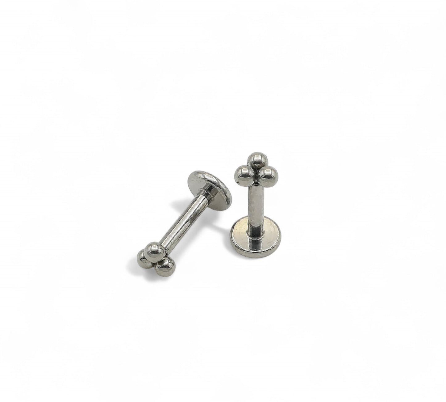 Titanium push fit trinity studs on a white background