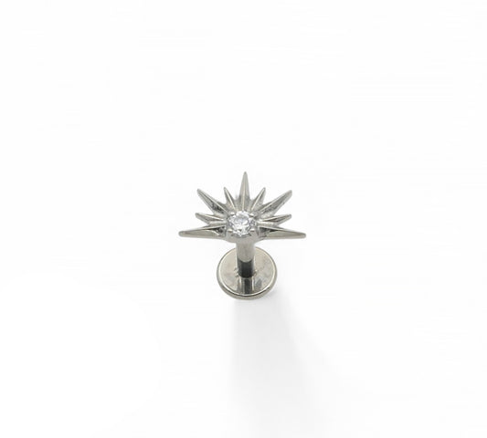 A silver-colored titanium stud earring with a claw-set cubic zirconia, designed for piercing.