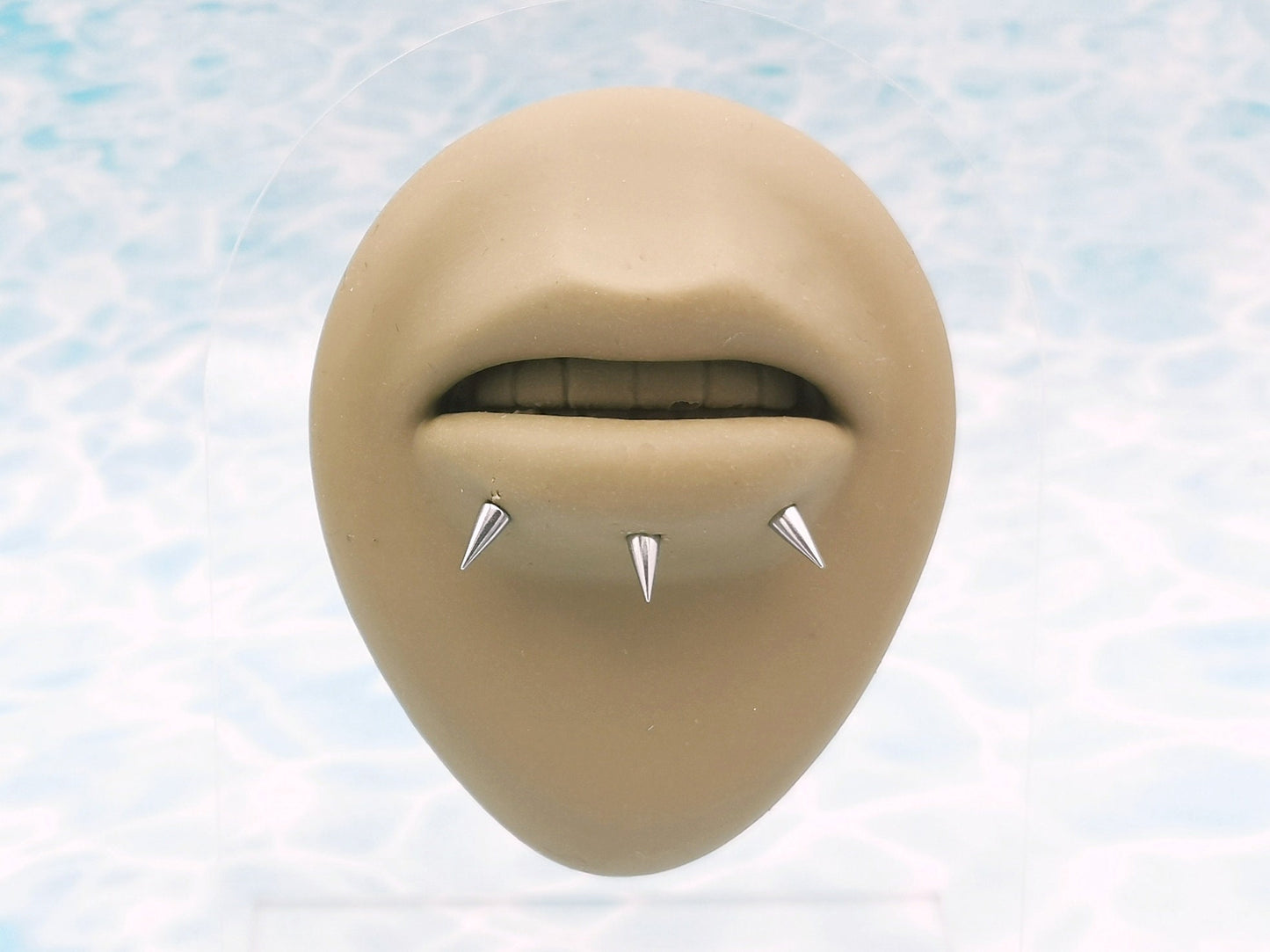 Titanium threaded spike studs on a mannequin