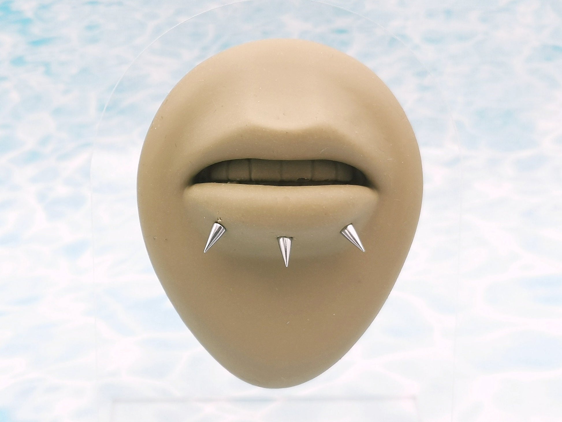 Titanium threaded spike studs on a mannequin
